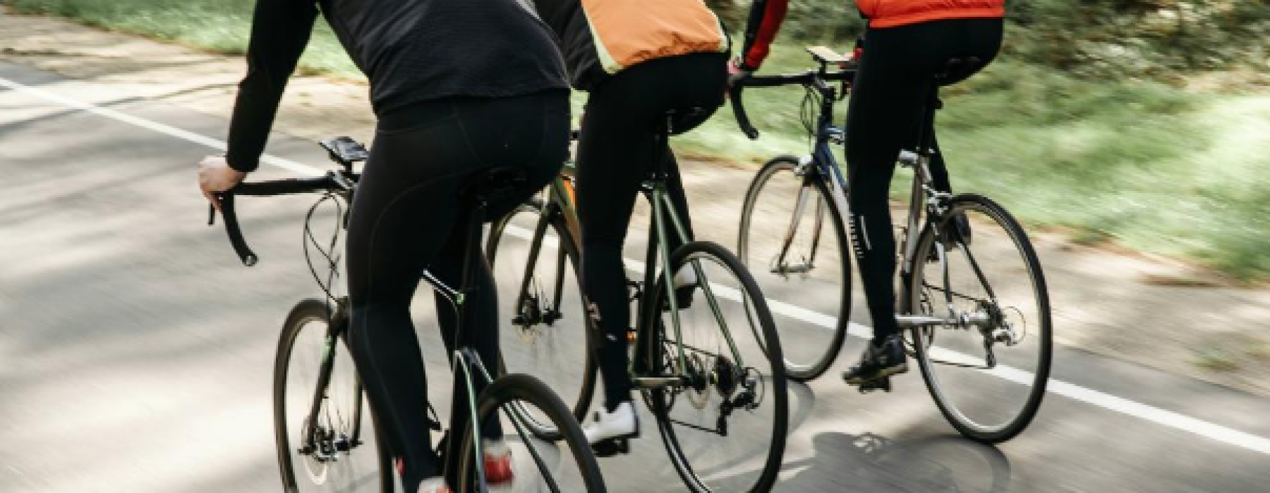 a group of people riding bikes